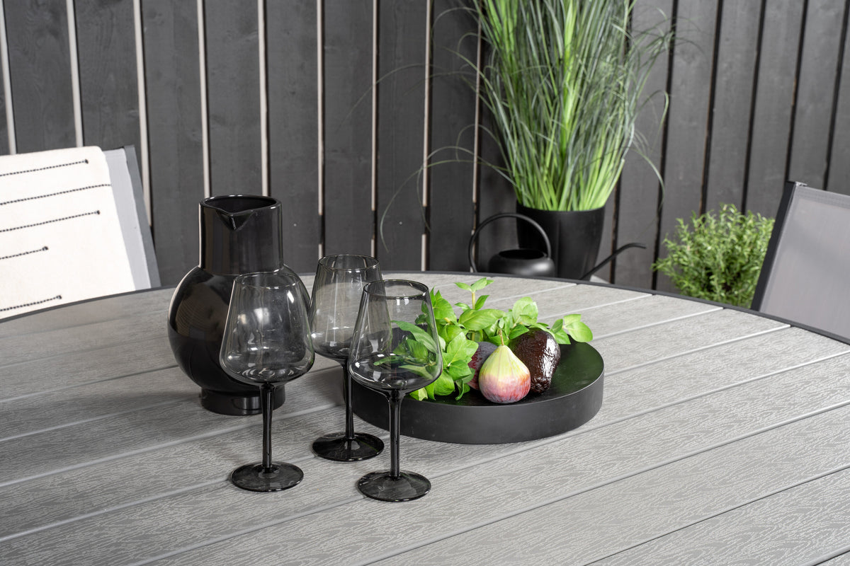 Parma matbord svart aluminium/grå aintwood Ø140 cm med Copacabana karmstol (stapelbar)