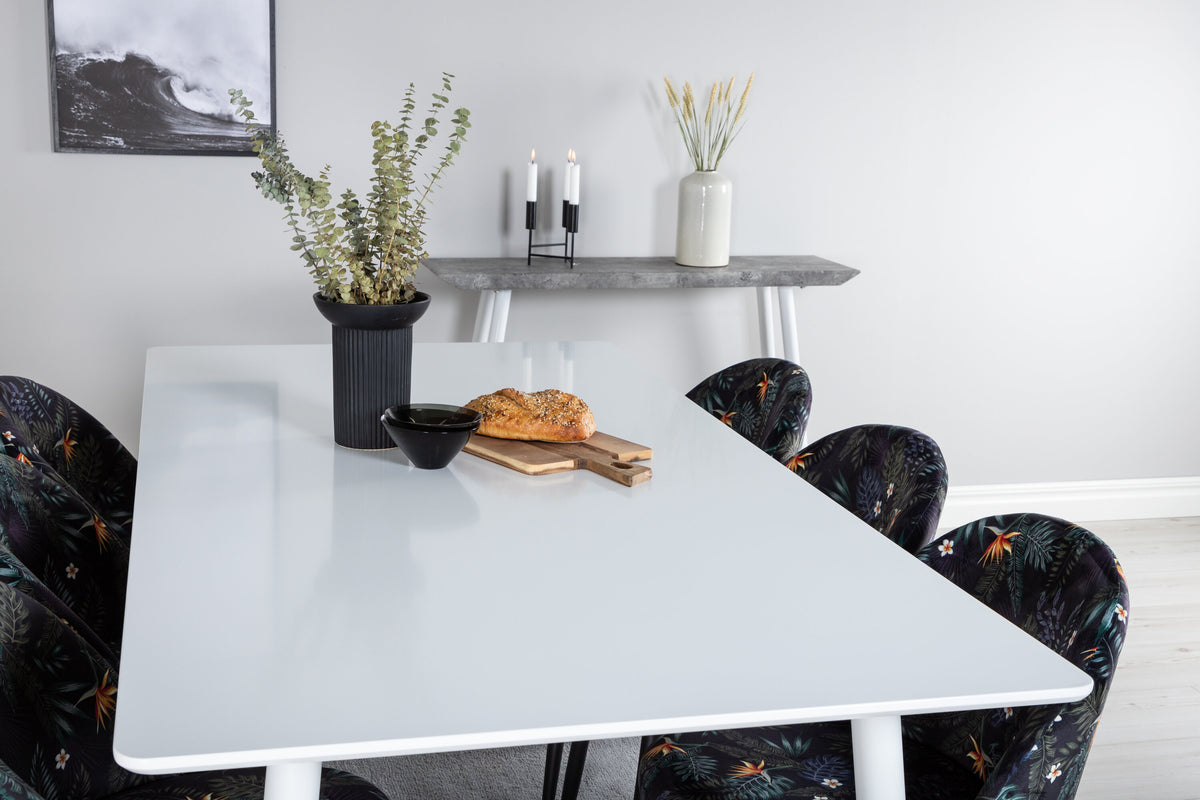 Polar matbord 180 cm vit topp/vita ben med 6 Velvet matstolar svart blommigt tyg