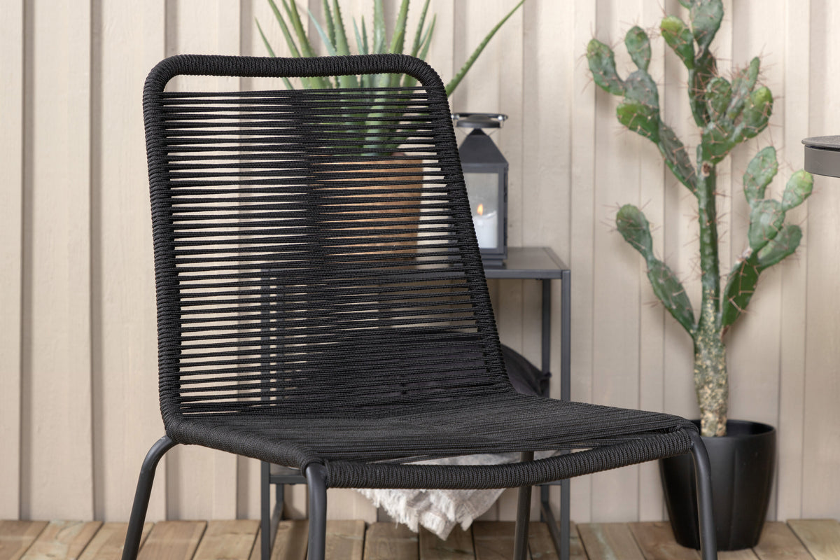 Tropea matbord svart stål/grått sprayglas med 4 Lindos stapelbara stolar svart aluminium/svart rep