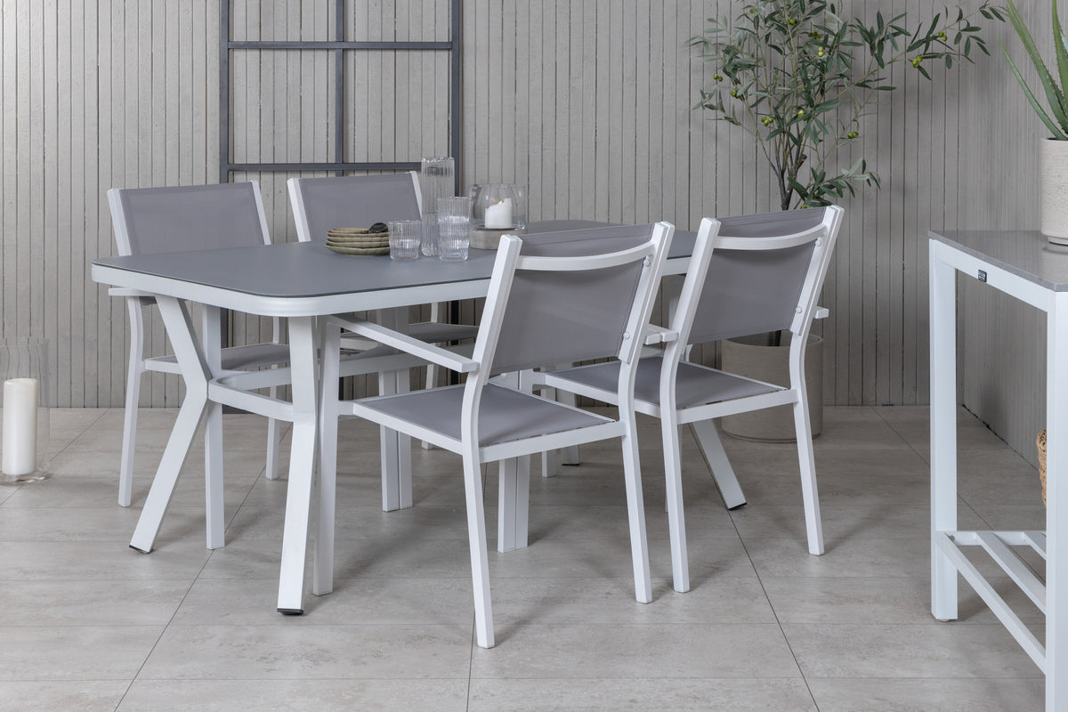 Virya matbord vit aluminium/grått glas med 4 Copacabana stapelbara stolar vit/grå