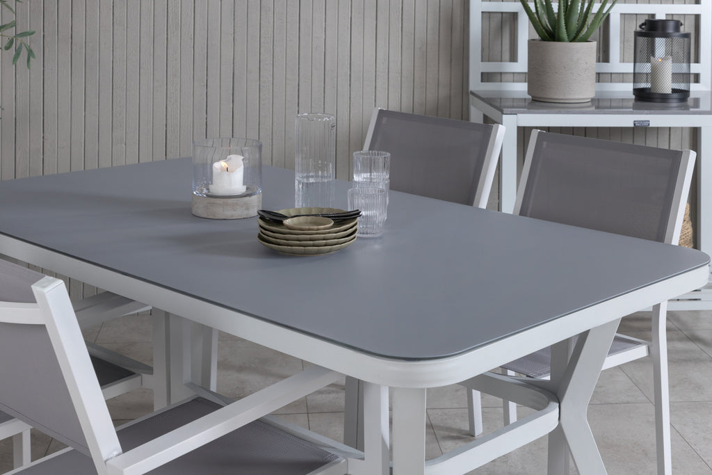 Virya matbord vit aluminium/grått glas med 4 Copacabana stapelbara stolar vit/grå