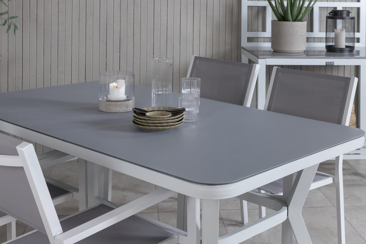 Virya matbord vit aluminium/grått glas med 4 Copacabana stapelbara stolar vit/grå