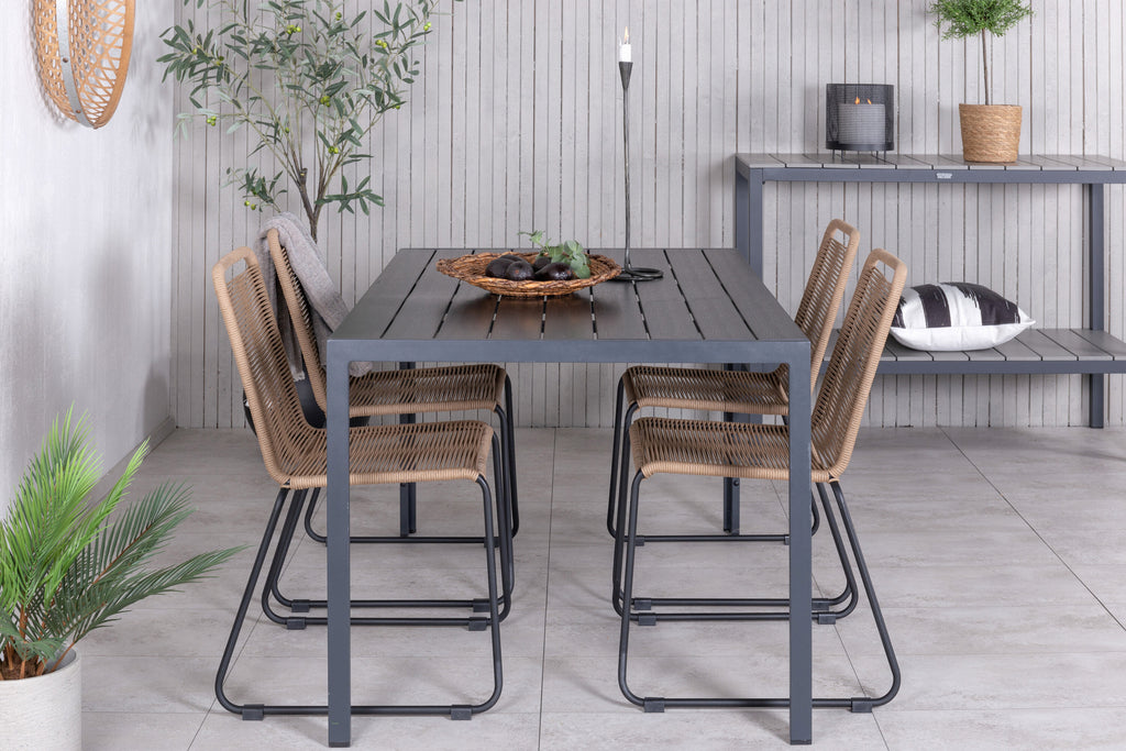 Break bord svart/svart 150x90 med 4 Lindos stapelbara stolar svart aluminium/latte rep