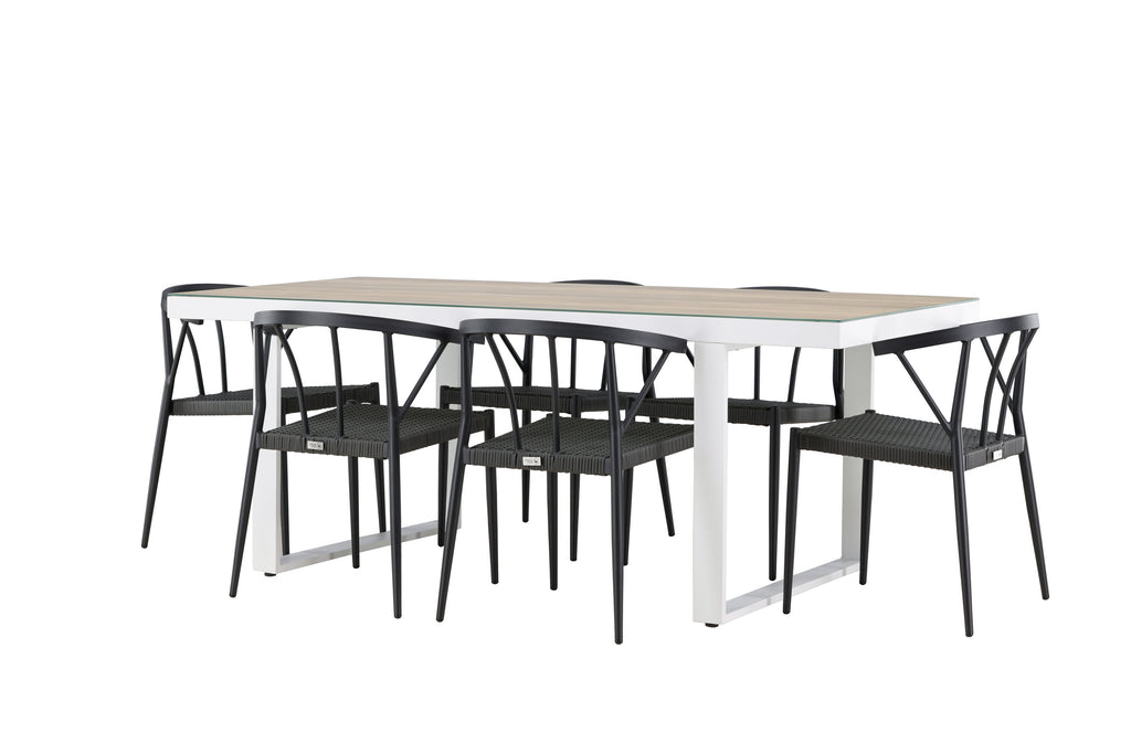 Merlo matgrupp med Stina-stolar vit och vitlaserad med svart aluminium och konstrotting